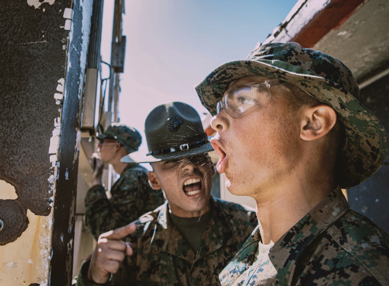Marine Corps Sergeant Alberto Ochoa, drill instructor with Fox Company, 2nd Recruit Training Battalion, corrects recruit during Table One Courseof Fire at Marine Corps Base Camp Pendleton, California, August 21, 2024 (U.S. Marine Corps/Sarah M. Grawcock)